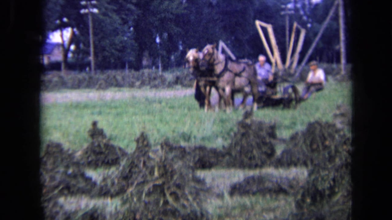 The rural 1963 Russia scene shows horses pulling equipment across grass, with farmers positioned beside and on the machinery.