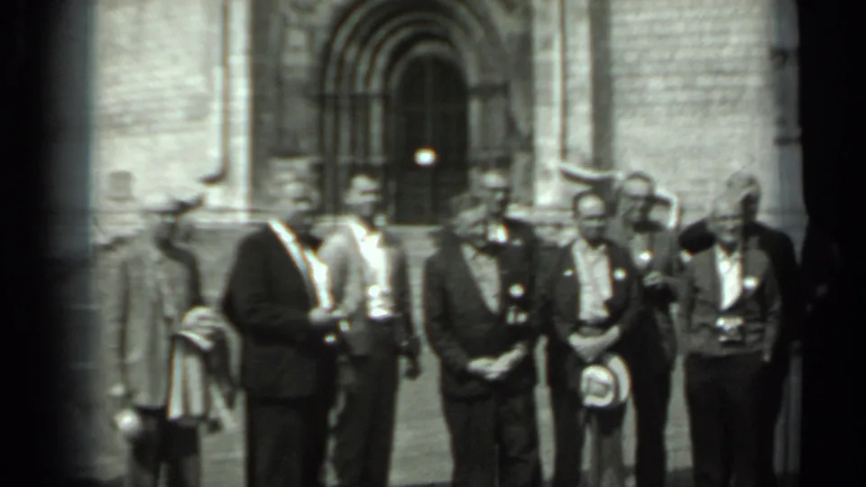A closer 1963 Russia view shows suited men waiting or posing before the ornate stone entrance.