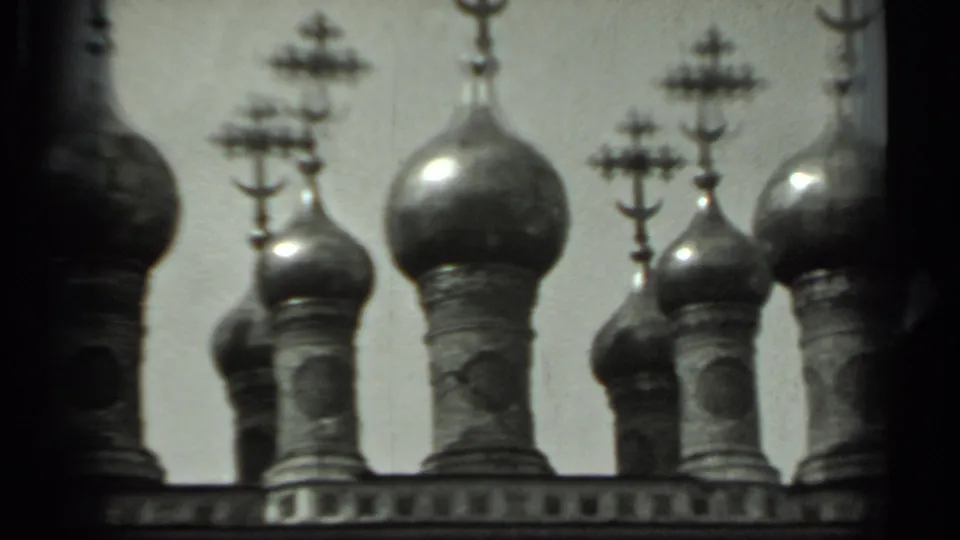 Russian Orthodox cathedral domes and crosses appear in soft monochrome 8mm footage from the supported 1963 Russia metadata.