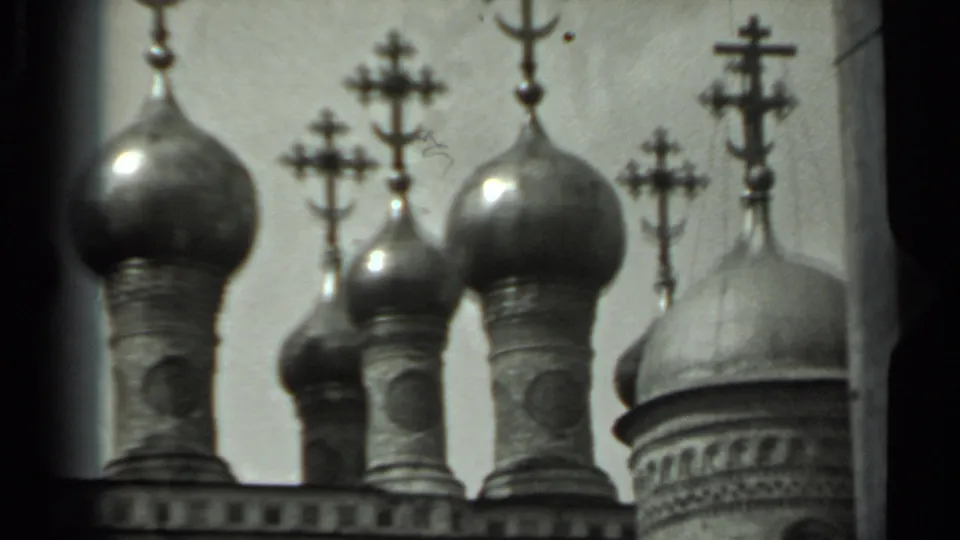 Final frame shows clustered onion domes and Orthodox crosses, with a larger adjacent dome partly visible on the right.