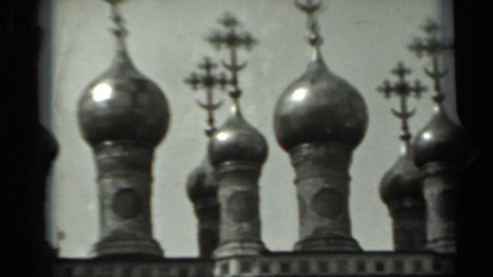 1963 Russia 8mm frame of clustered Orthodox domes and crosses, partly bordered by a dark film strip edge.