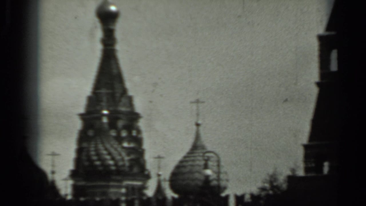 1963 Russia 8mm frame with soft, dark views of Orthodox-style domes and crosses beneath an overcast sky.
