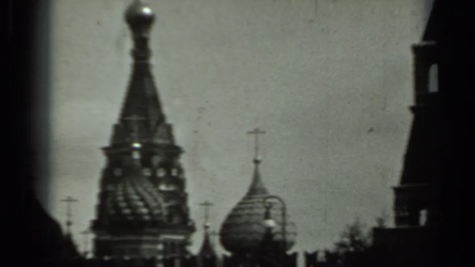 1963 Russia 8mm frame with soft, dark views of Orthodox-style domes and crosses beneath an overcast sky.