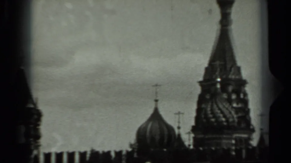 1963 Russia 8mm frame showing onion domes, crosses and an ornate spire in soft black-and-white focus.