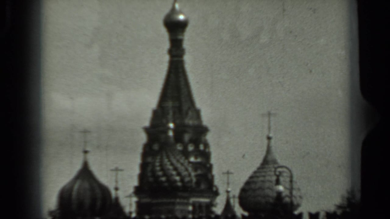 Onion domes, roof crosses and an ornate spire seen across a skyline.