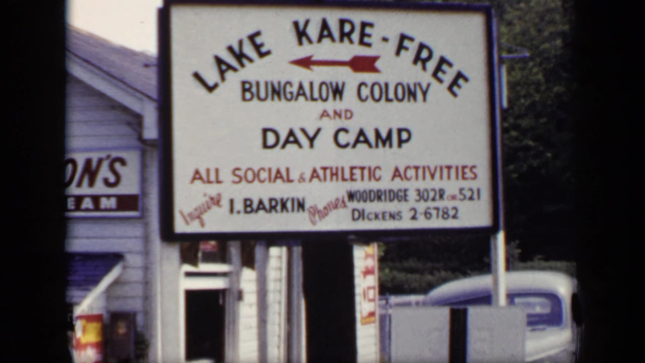 Large Lake Kare-Free Bungalow Colony and Day Camp sign beside a building.