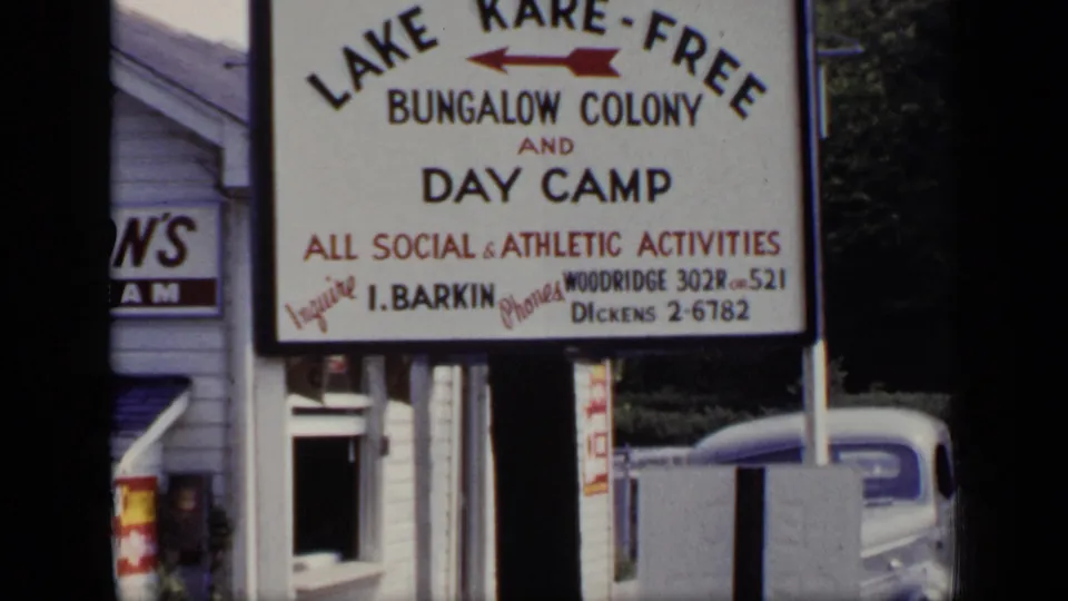 1948 New York 8mm frame holding on the Lake Kare-Free sign, with social and athletic activities and contact information legible.