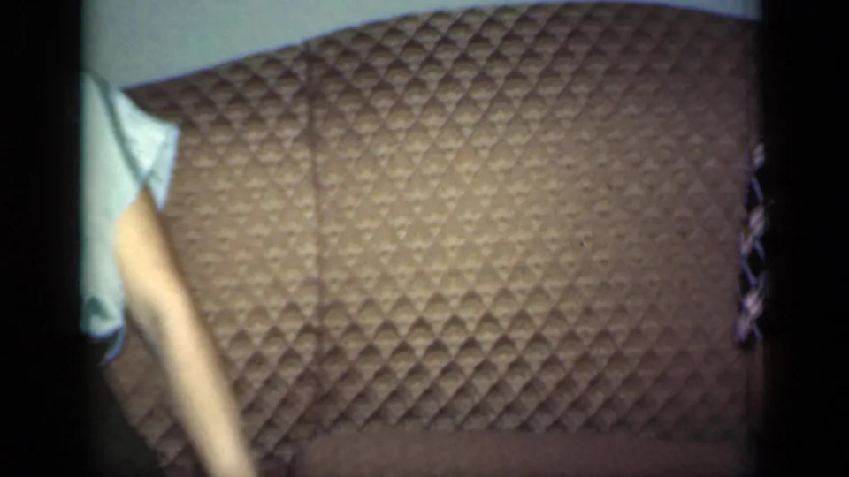 The final frame is mostly the brown quilted sofa, with only part of the woman's blouse and arm visible at the left edge.