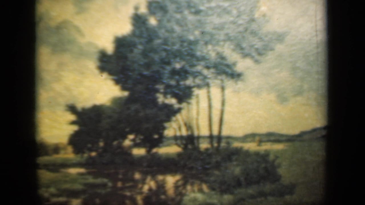 1949 New York interior footage frames a landscape painting of trees and water, seen close enough to show the decorative border.