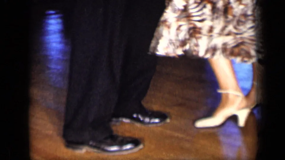 The final frame shows the dancers' feet and lower bodies, including black dress shoes, white heels, and a patterned skirt on the wood floor.