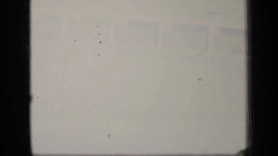 Nearly washed-out end frame from the Puerto Rico airport clip, with only faint tarmac and aircraft traces visible.