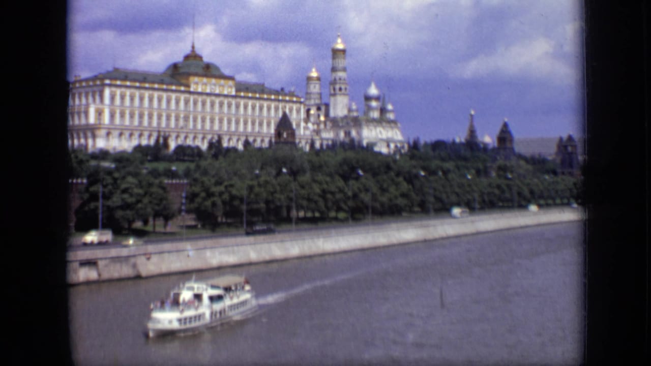 Passenger boat on the Moscow River with the Kremlin complex in the background.