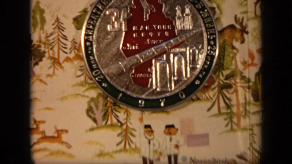 A tighter 1971 Moscow frame crops the commemorative coin at the top while showing illustrated people, trees, animals, and map-like cloth details below.