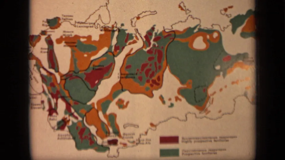Printed Soviet Union resource map with multicolored regions, labels, and a small legend, shown in the same 1971 home-movie sequence.