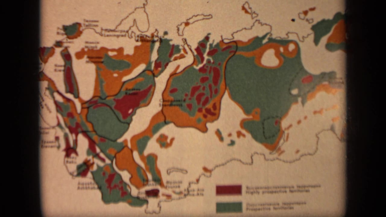Printed color map of Russia with orange, green, and red zones and a small legend.