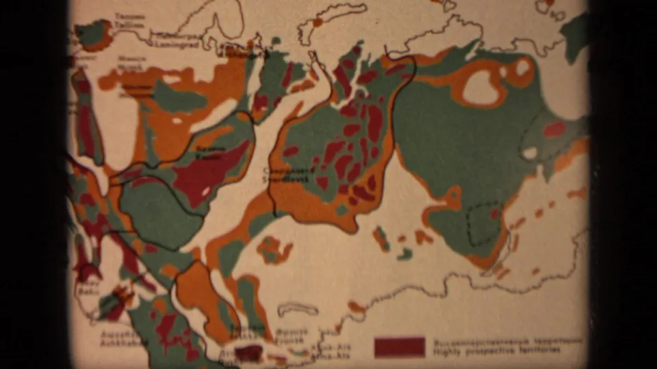 Close 1971 view of a printed Russia map, showing orange, green, and red geological-style areas with Cyrillic and English labeling.