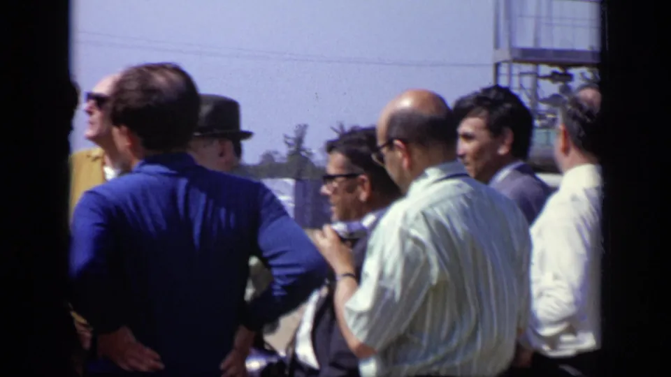 The final frame shows the Moscow outdoor group from behind and side angles, with men in shirts, suits, glasses, and hats.