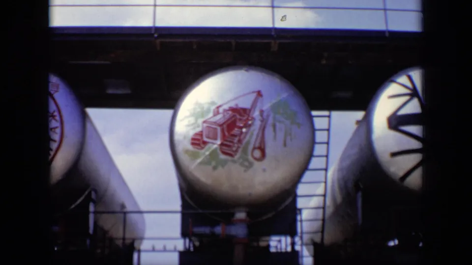 Final 1971 Moscow frame showing multiple cylindrical tanks, a ladder, platform structure, and painted machinery graphics.