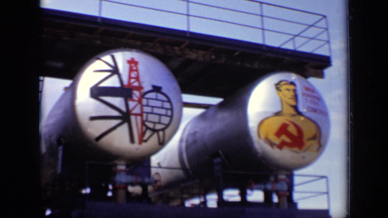 1971 Moscow frame with cylindrical tanks painted with a red derrick, globe motif and worker figure bearing a hammer and sickle.