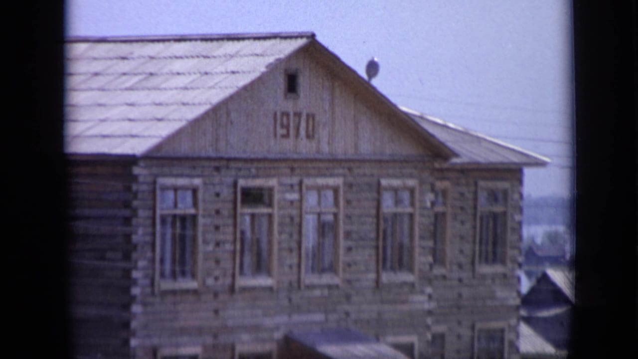 Upper portion of a wooden house with 1970 marked on the gable.