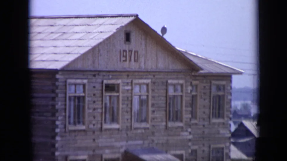 1971 Moscow view of a wooden house facade, showing the 1970 gable mark and rows of windows.