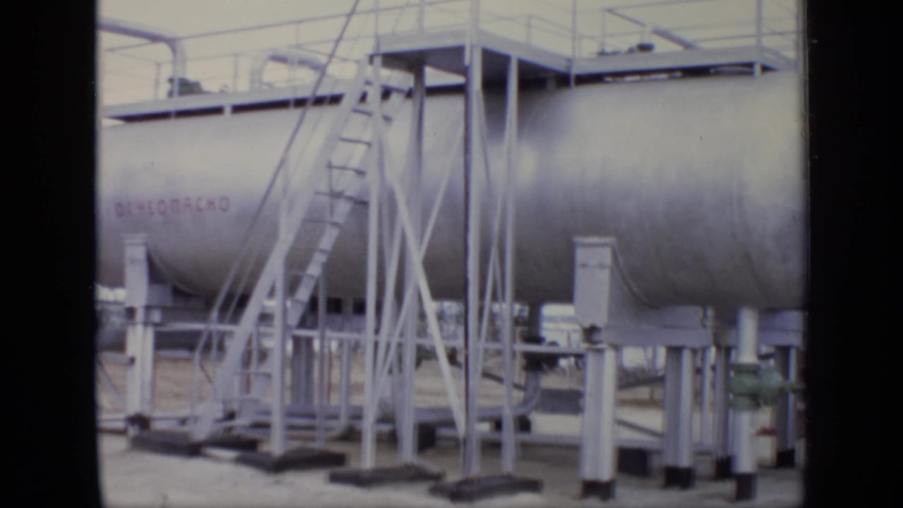 1971 Moscow industrial site view showing a large cylindrical tank, railings, ladders, piping, and partial Cyrillic lettering.