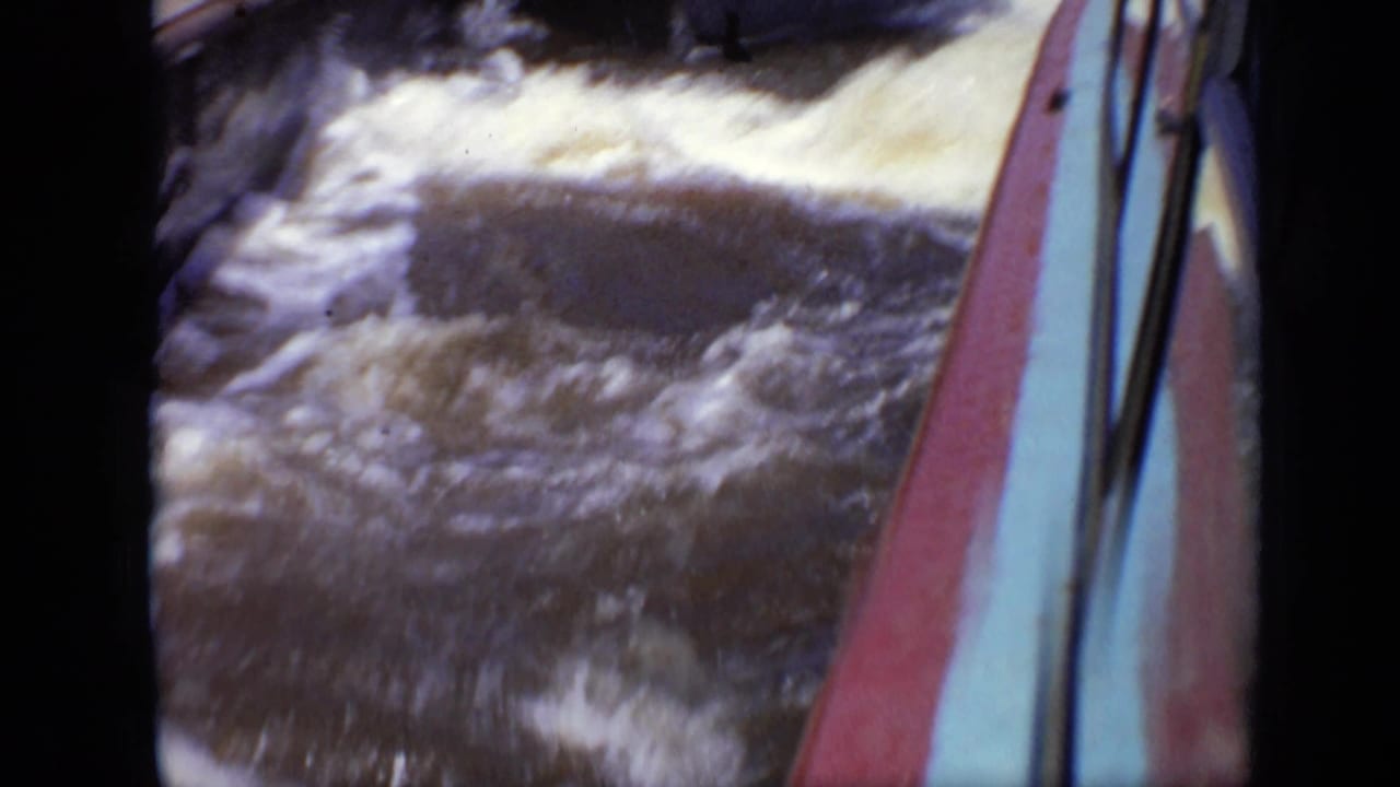 1971 Moscow 8mm frame with rough water and the side of a boat visible along the right edge.