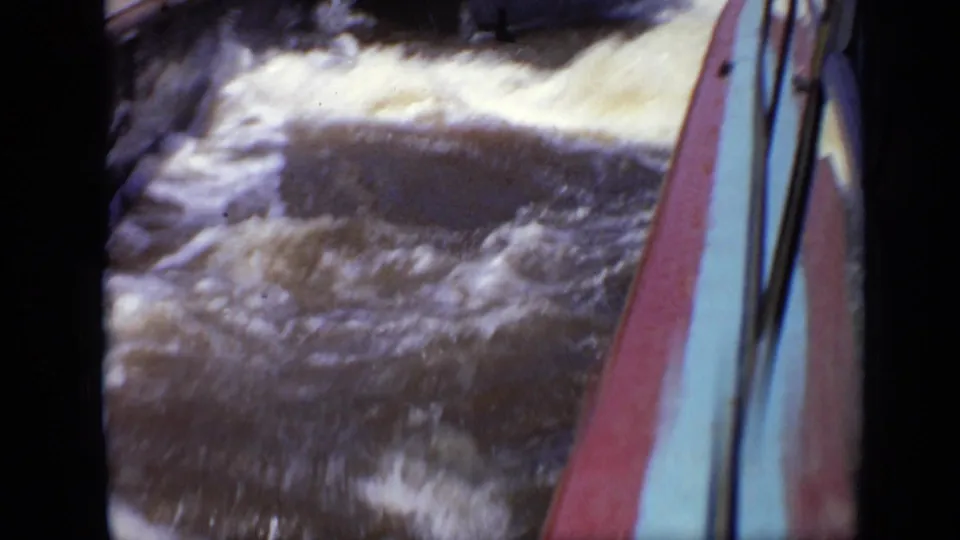 1971 Moscow 8mm frame with rough water and the side of a boat visible along the right edge.