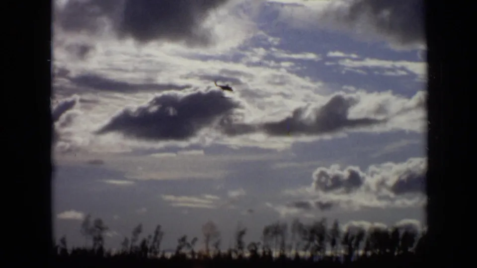 Final 1971 Moscow frame with the helicopter near the upper sky and a distant treeline along the bottom edge.