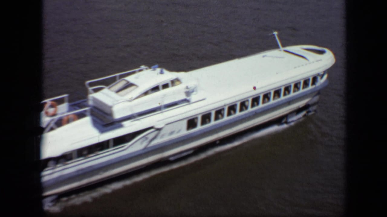 White passenger ferry cruising on a Moscow river in 1971, with small passengers visible on the open rear deck.