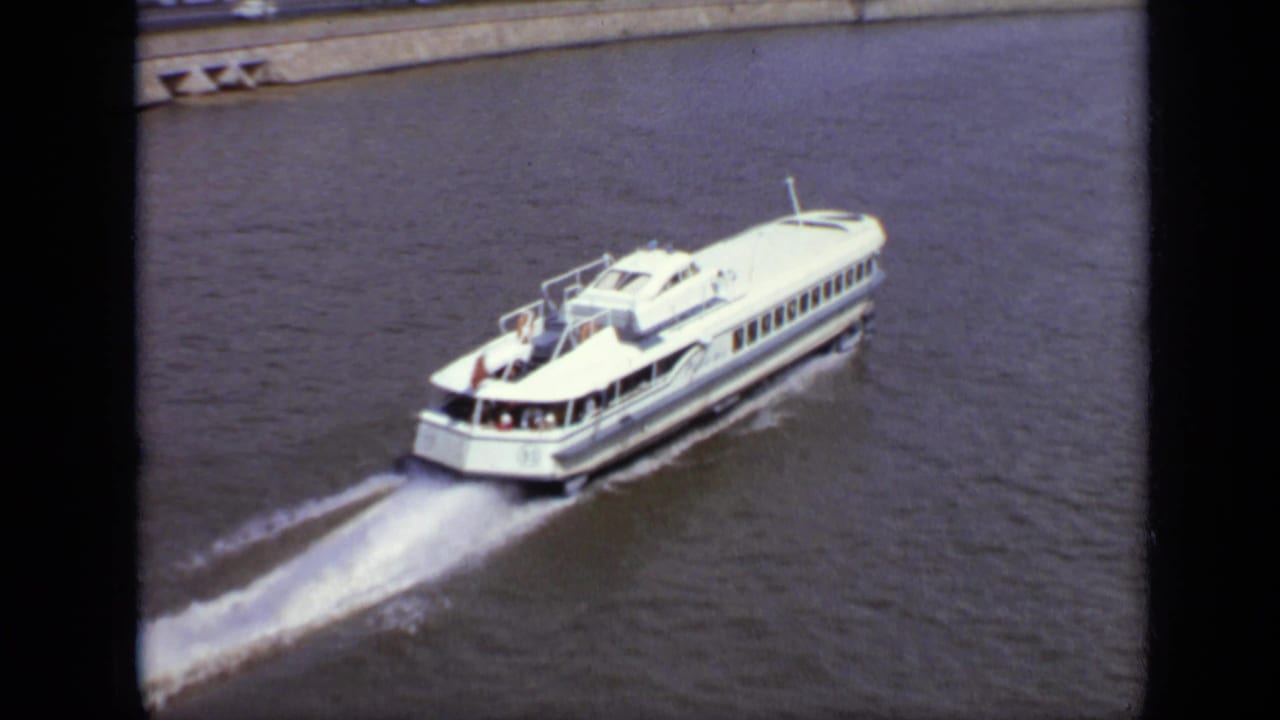 Passenger ferry moving away and leaving a bright wake.