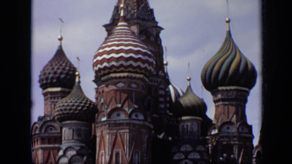 Close 1971 8mm view of St. Basil's Cathedral in Moscow, emphasizing patterned onion domes, brick towers, and ornate spires.
