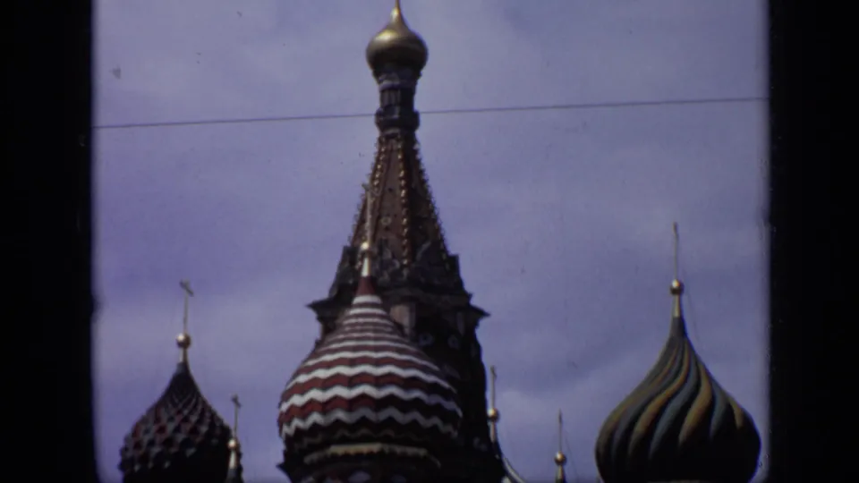 1971 Moscow 8mm view of St. Basil's Cathedral domes, including striped and ribbed onion shapes under a pale sky.