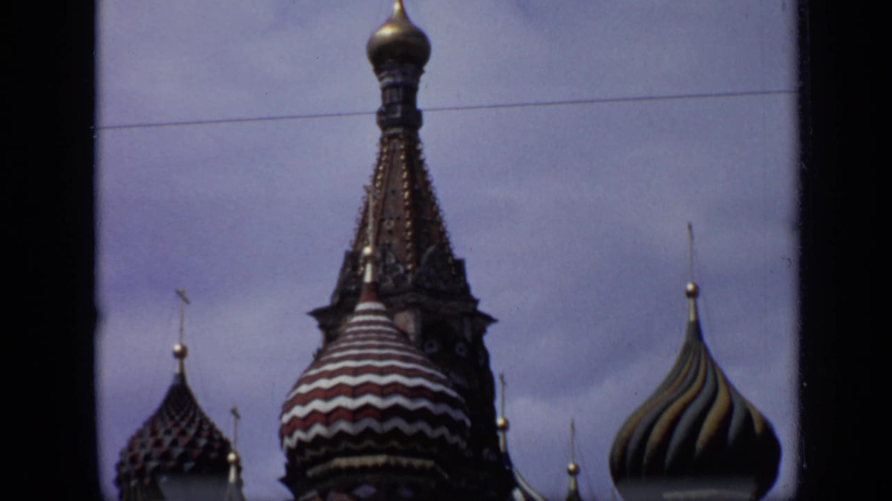 Colorful onion domes and spires of St. Basil's Cathedral framed by film borders.