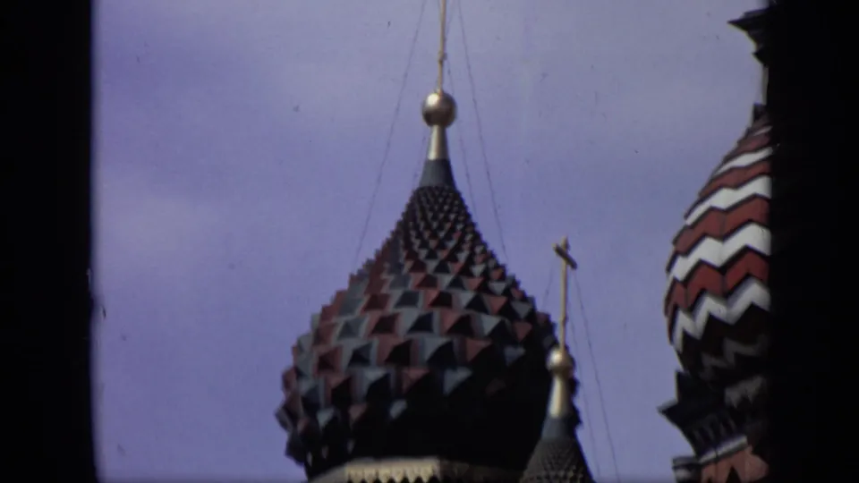 1971 Moscow home-movie close-up of a dark tiled St. Basil's dome, with a red and white striped dome partly entering the frame.