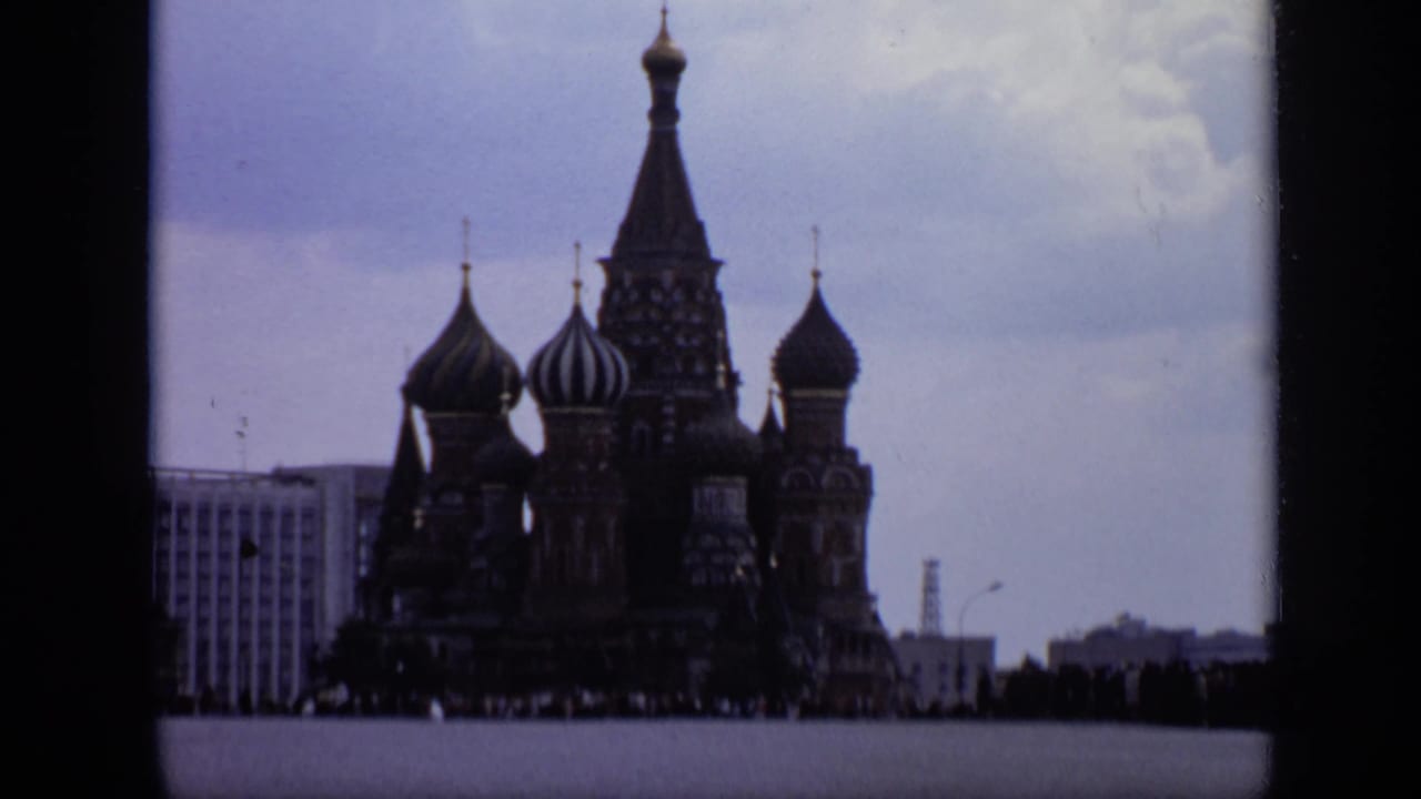St. Basil's Cathedral seen from Red Square with onion domes and overcast sky.