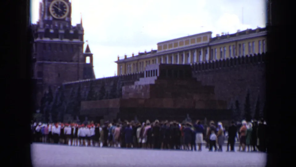 1971 Moscow frame showing people gathered in Red Square with the Kremlin wall and Spasskaya Tower at left.