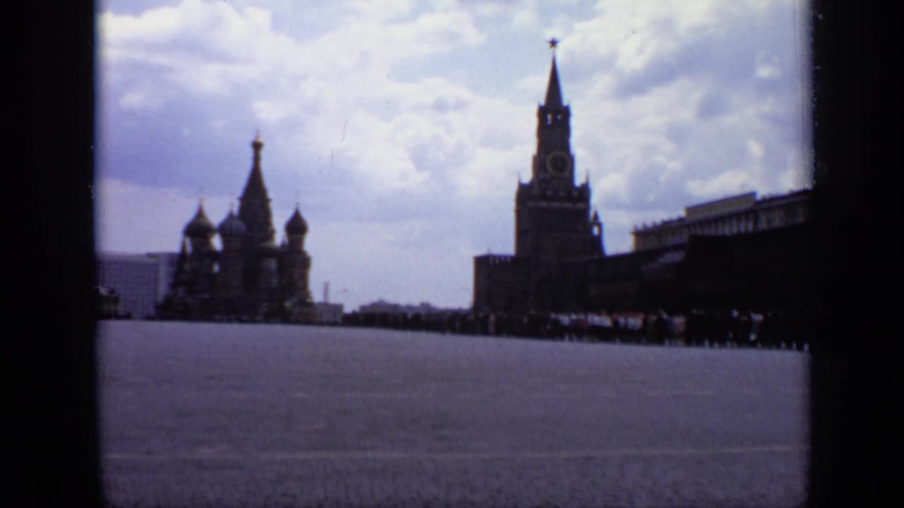 Red Square with St. Basil's Cathedral and Spasskaya Tower in the distance.