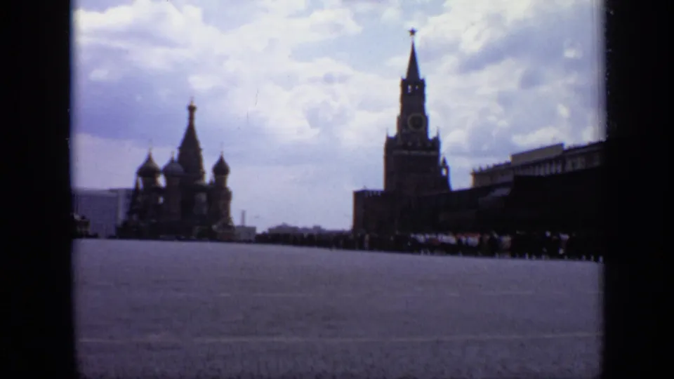 Wide 1971 Moscow view across Red Square toward St. Basil's Cathedral, Spasskaya Tower, and distant crowds.