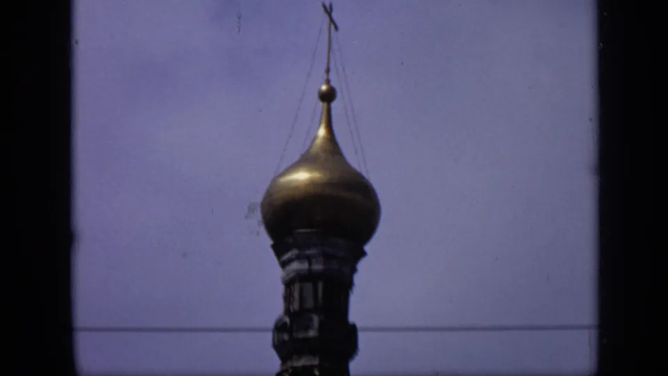1971 Moscow 8mm close-up of a gilded onion dome with a cross, likely part of the Kremlin cathedral skyline.