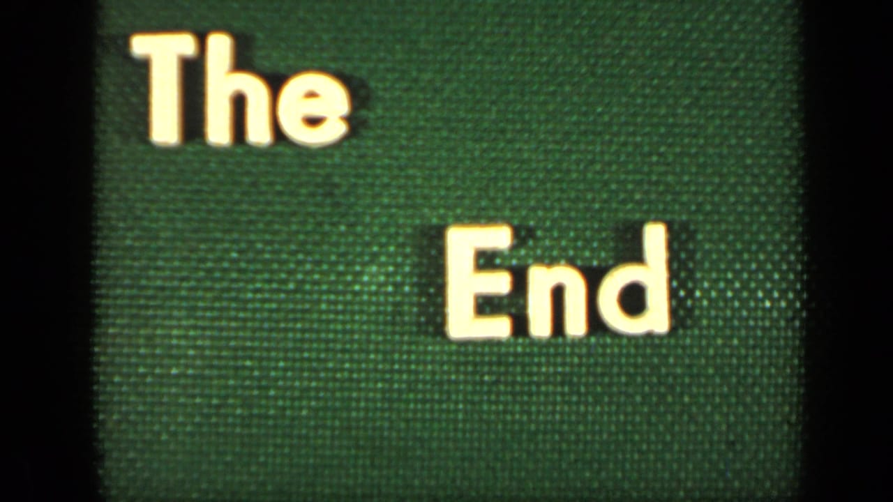 White "The End" lettering on a textured green background with dark film edges.