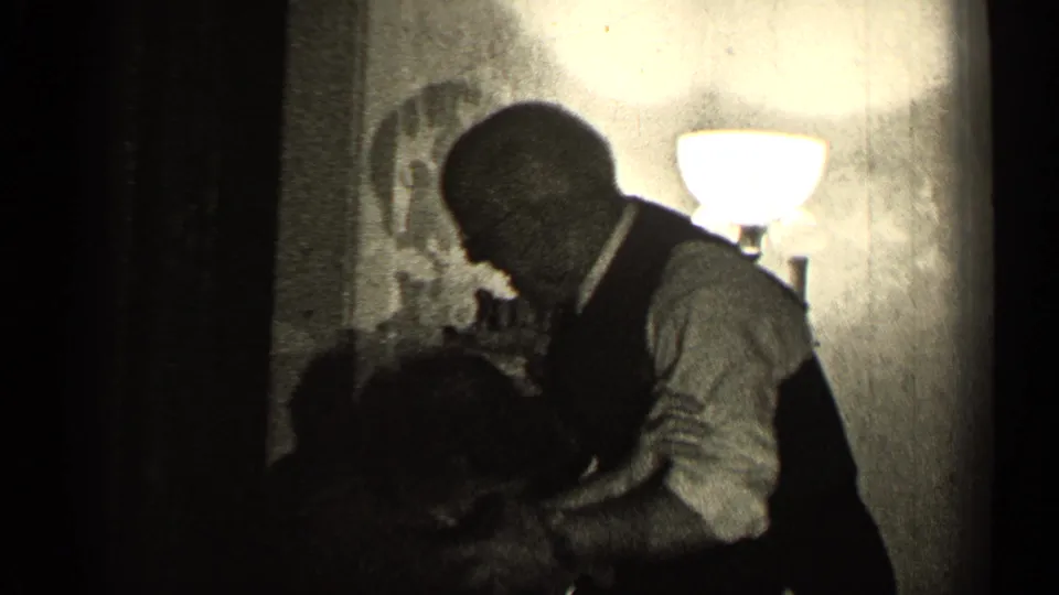 The final 1947 Illinois frame shows the man leaning over the seated woman, with a glowing lamp and chair in the private room.