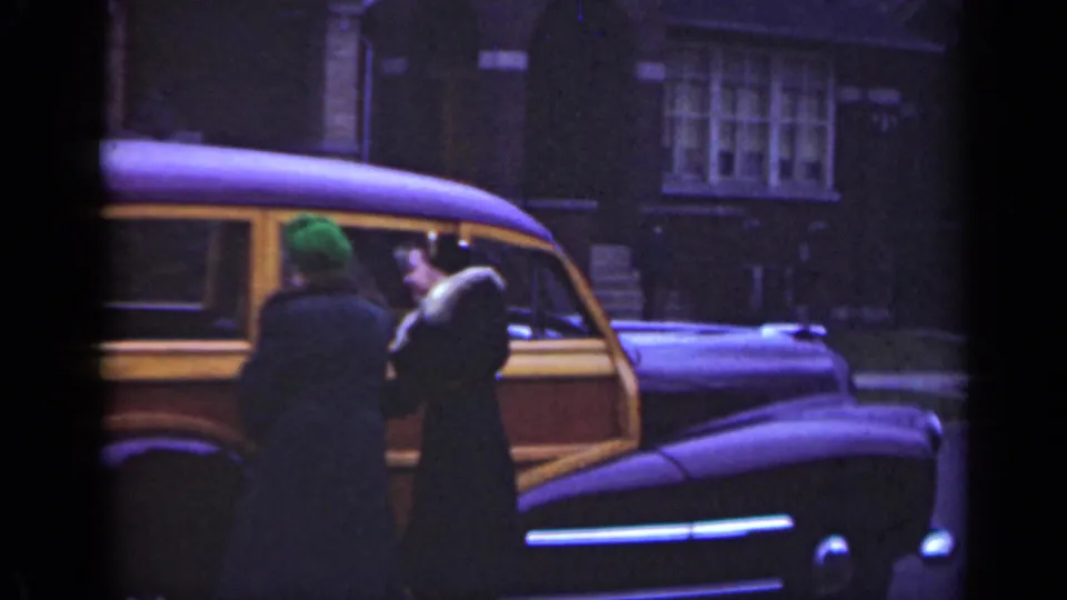 In the final 1947 Illinois frame, an adult in a dark fur-collared coat turns near the wood-paneled station wagon while another person faces them.