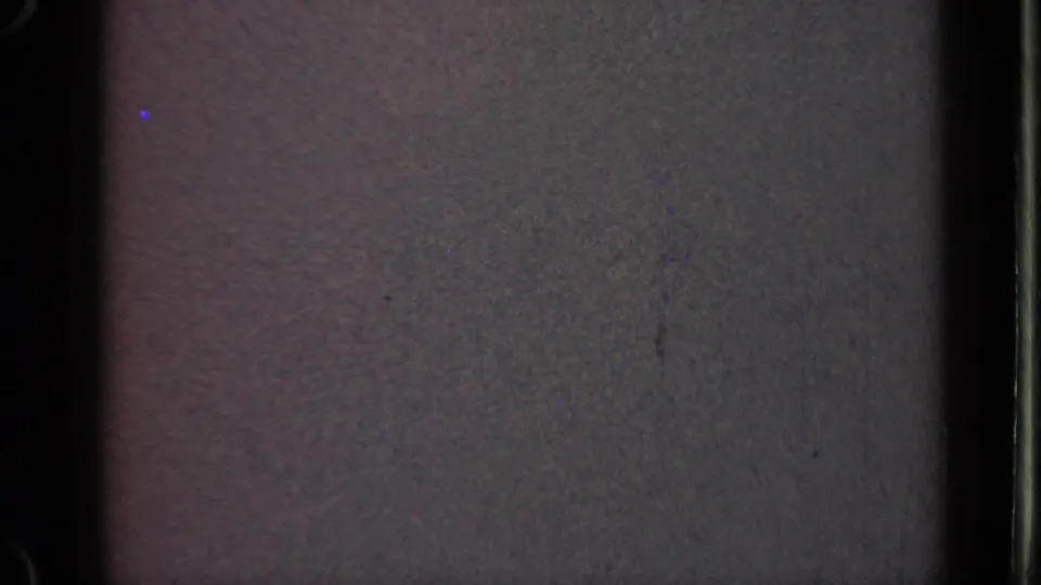 1947 Illinois 8mm frame with a largely blank gray screen-like field, a central dark band, visible scratches, grain, and a pale vertical edge at right.