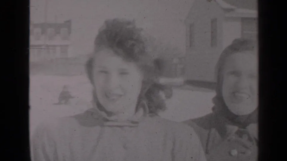Close 1947 New York winter frame of two women near the camera, one centered and one partly cropped at the right edge.