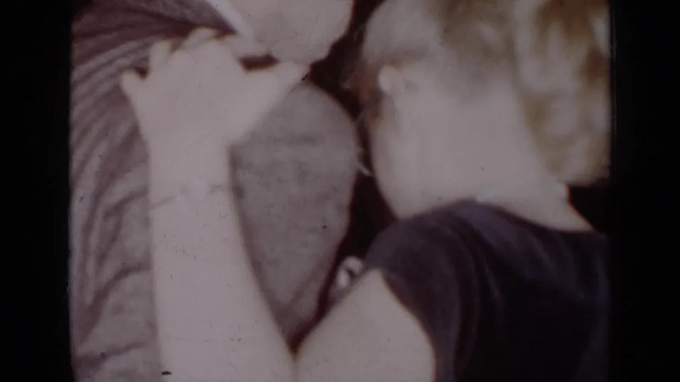 In the final 1954 New York frame, the woman in a dark dress faces the suited man closely, with her arm raised near his shoulder.