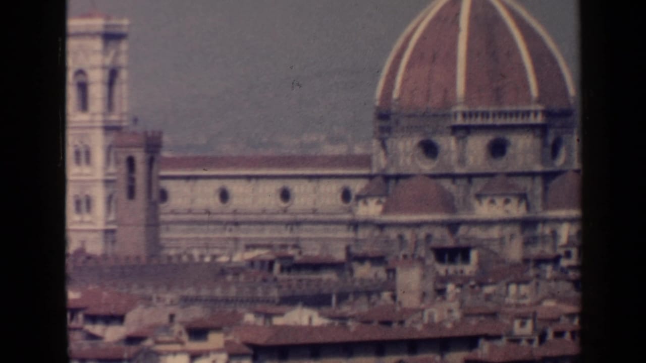 Florence Cathedral dome, bell tower, facade, and rooftops.