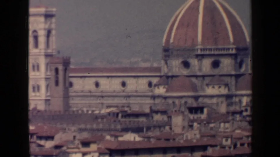 Florence Cathedral appears in a soft 8mm city view with the dome, bell tower, and surrounding rooftops.