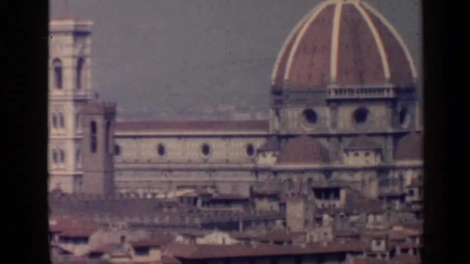 A closer 8mm frame shows Florence Cathedral dome and bell tower above a dense roofline.
