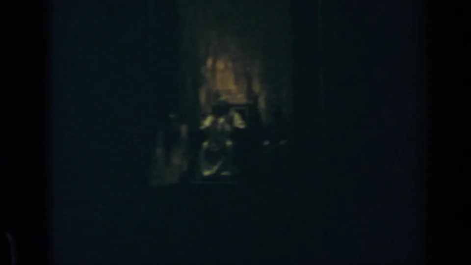 Underexposed 1960 Rome frame showing a faintly lit religious interior with possible altar detail and obscured forms.
